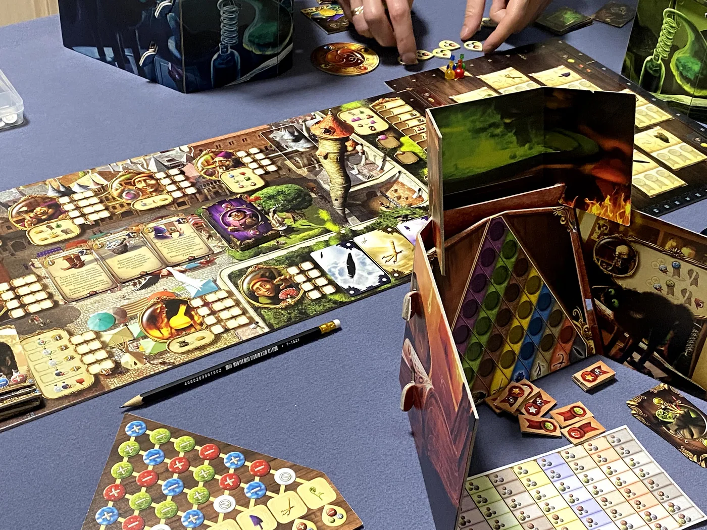 Our Alchemists game: the main board, a lab screen with the potion grid and the ingredient triangle · 1