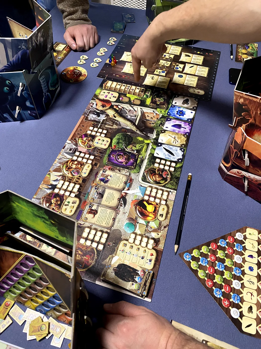 Our Alchemists game: the main board, a lab screen with the potion grid and the ingredient triangle · 2