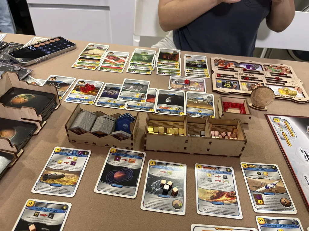 Our Terraforming Mars game in progress: the board, wooden organizer trays and player mats · 2