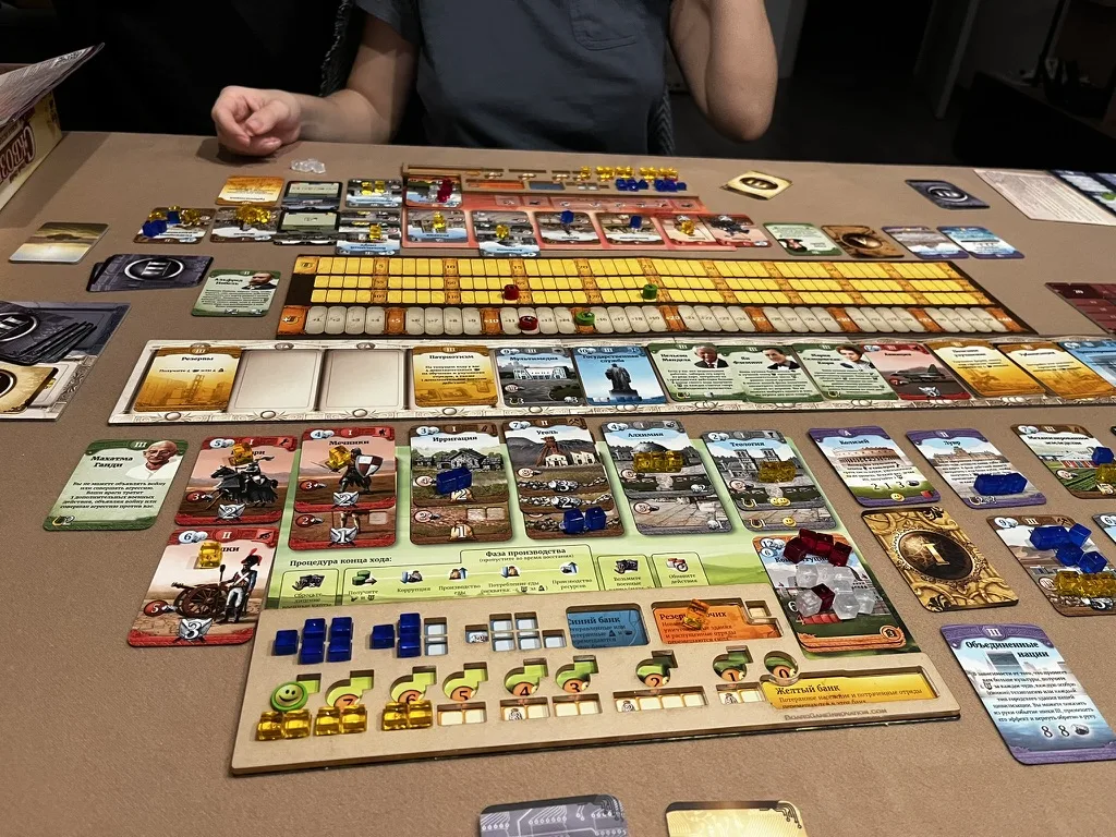 Our Through the Ages session: card rows, a civilization board and resource cubes · 1