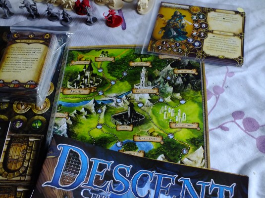 Descent campaign board and rulebooks spread out on the table · 1
