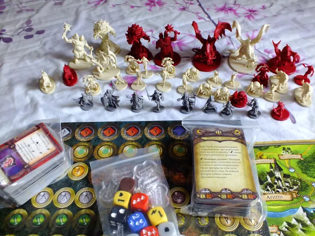 Descent miniatures lined up, with close-ups of the monster figures · 1