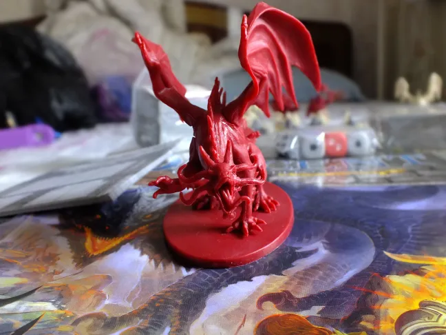Descent miniatures lined up, with close-ups of the monster figures · 2